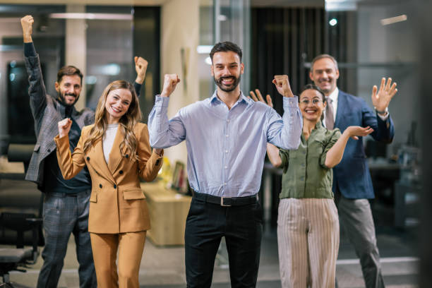 istock Diverse team of professionals posing together in a modern coworking office environment. 2199139295