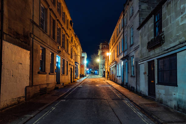 istock Empty street in bath at night illuminating traditional architecture 2199139965