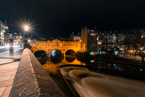 istock Pulteney bridge crossing avon river at night in bath, england 2199139970
