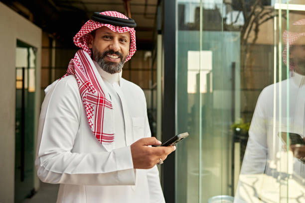 istock Candid portrait of Riyadh businessman using smart phone 2199140001