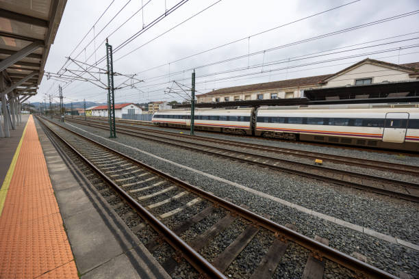 istock High-Speed Train at Railway Station Platform Scene 2199140057