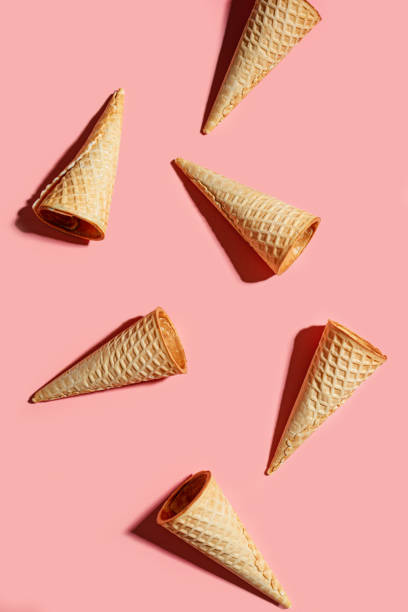 istock Ice cream waffle cones on pink 2199140485