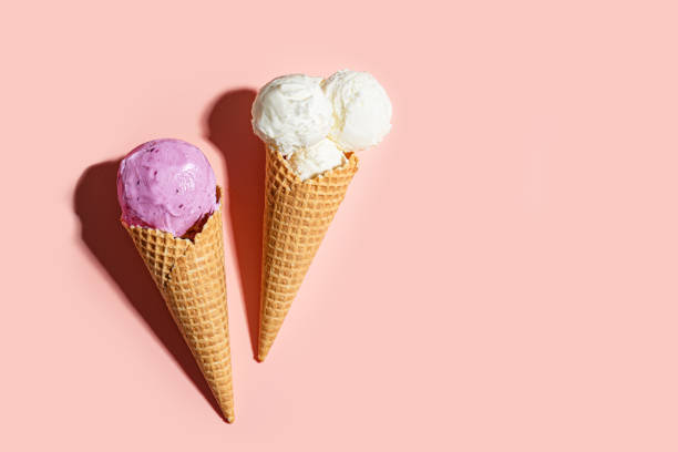 istock Two crispy ice cream cones vanilla and blueberry flavors 2199140575