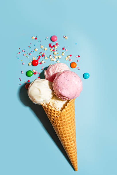 istock Waffle cone with vanilla and strawberry ice cream scoops 2199140827