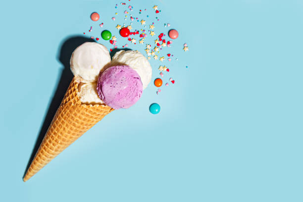 istock Ice cream cone with various scoops and sugar sprinkles 2199140923