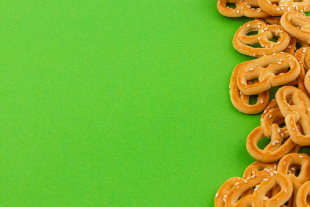 A fresh Bavarian pretzel isolated on white background. The pretzel is a traditional Bavarian pastry and is a popular snack.
