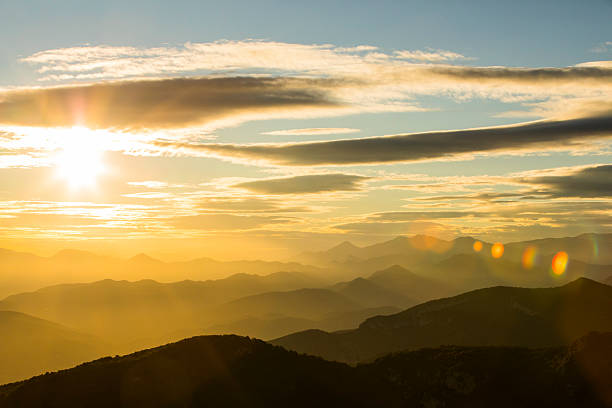 Sunset and wind clouds in La Garrotxa, Girona, Spain.