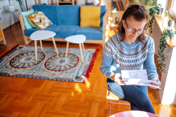 istock Mature adults spending time enjoying alone at home and going through home finances 2199149412
