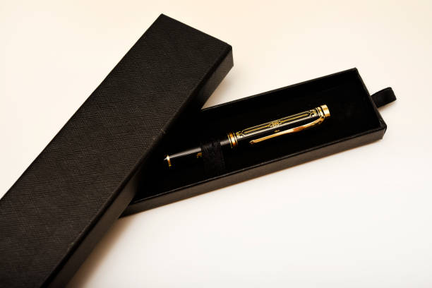 istock A gift pen in a box. A black fountain pen. 2199150212