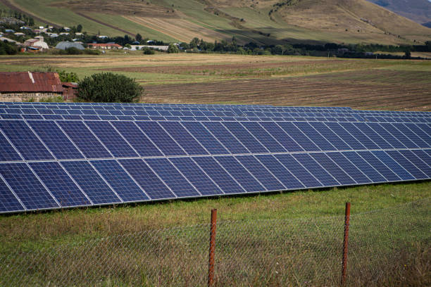 istock solar panels on the green grass. solar energy. 2199155029