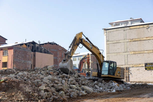 Deconstruction site with close-up of claw of excavator tearing down apartment building at Swiss city of Zürich on a late summer morning. Photo taken September 9th, 2025, Zurich Schwamendingen, Switzerland.