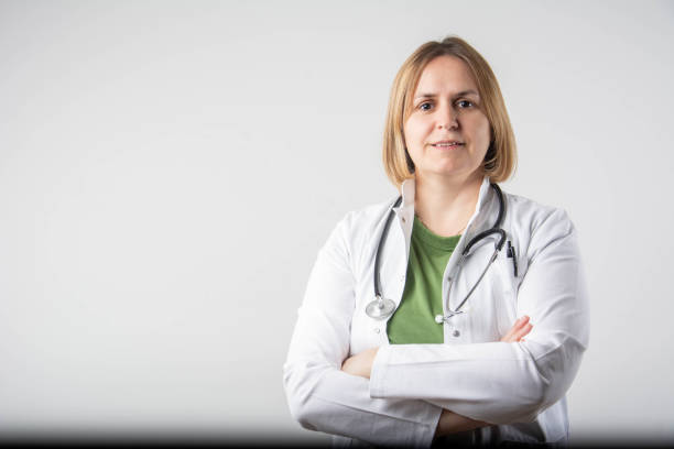istock Cheerful doctor. Medical Professional In Lab Coat At Studio 2199156307