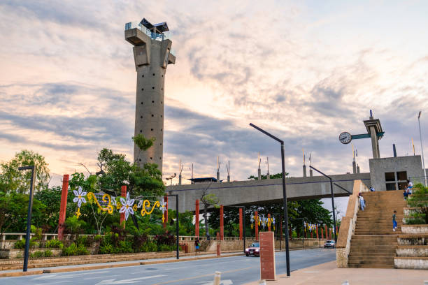 Villahermosa, Mexico - December 23rd, 2024. Pedestrian bridge over Grijalva River, with observation tower, with kids playing in the staircase leading to the bridge