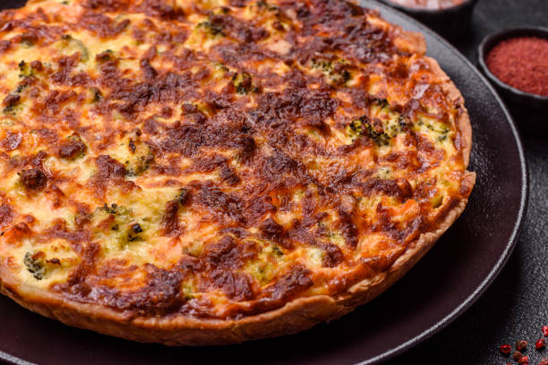istock Delicious fresh quiche with broccoli, cheese, spices and herbs 2199158058