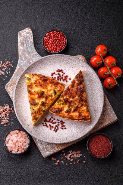 istock Delicious fresh quiche with broccoli, cheese, spices and herbs 2199160340