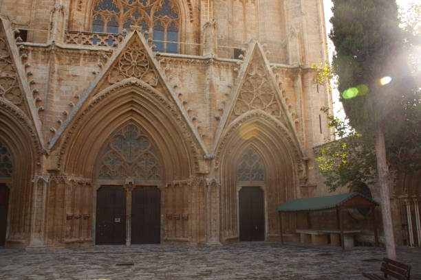 istock Gothic cathedral front with detailed stone carvings and a grand arched entryway 2199166215
