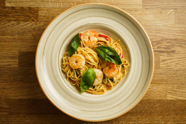 istock Shrimp pasta with fresh basil and cherry tomatoes 2199166873