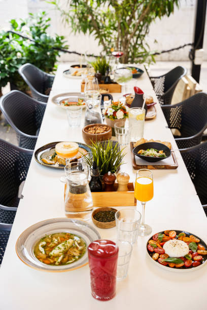istock Outdoor brunch table setup with diverse dishes and drinks 2199166881