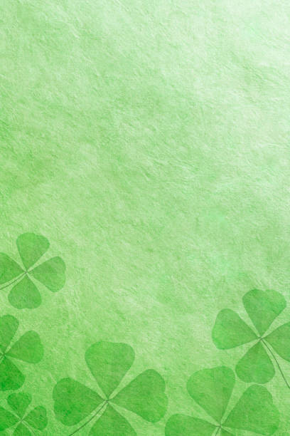 istock Shamrock Shapes On A Green Background 2199168822