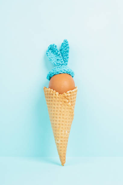 istock Easter egg with ears, bunny or rabbit in an ice cream cone, spring holiday, greeting card 2199168911