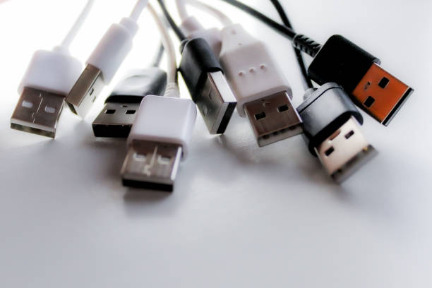 istock Top down view-up of twisted usb cords cables on white background 2199170102