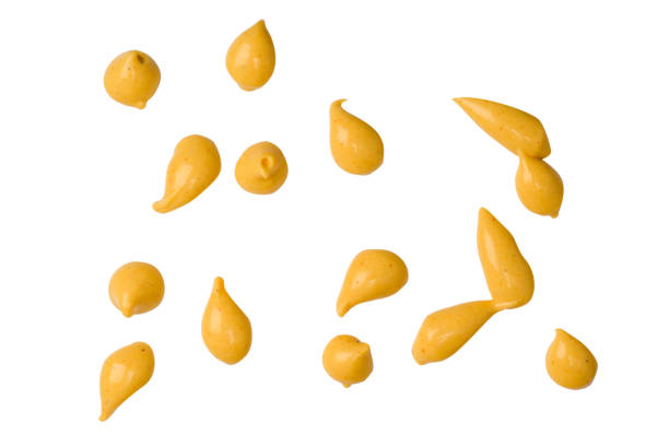 istock Yellow sauce splashes isolated on white background. 2199172460