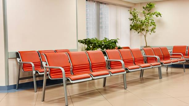 istock A modern waiting area with red seating and lush greenery, creating an inviting atmosphere 2199174525