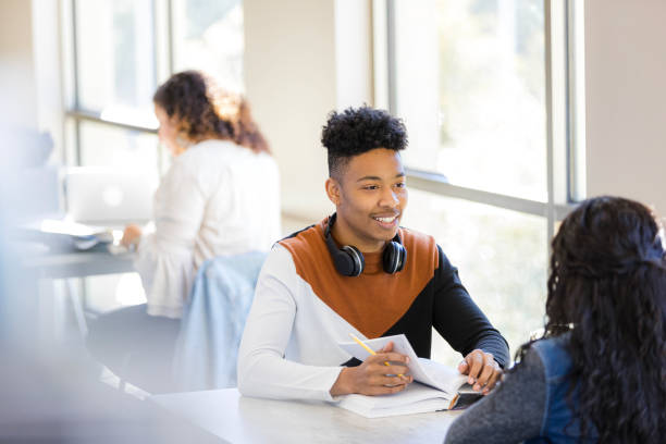 istock Student and Professor Discussing Ideas in University Classroom 2199176502