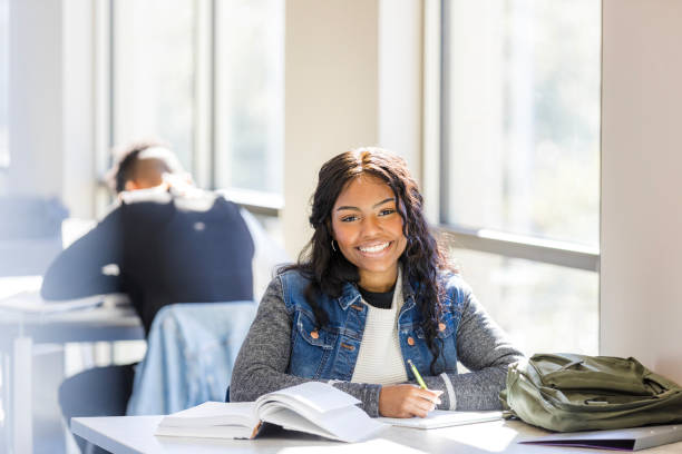 istock Happy Female University Student Studying in Classroom 2199176529