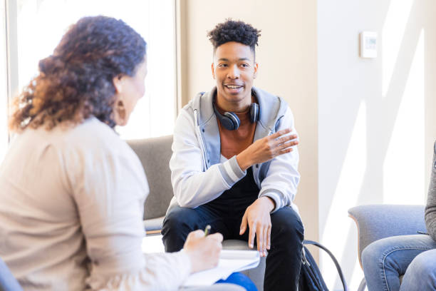 istock Young Man in Counseling Session, Discussing Mental Health 2199176559