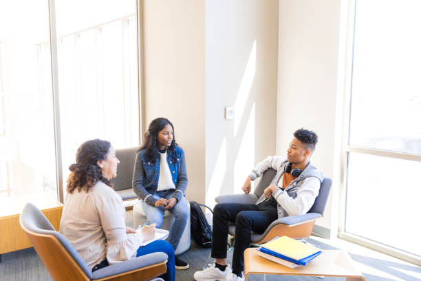 istock Group Therapy Session: Students Discussing Mental Health 2199176560