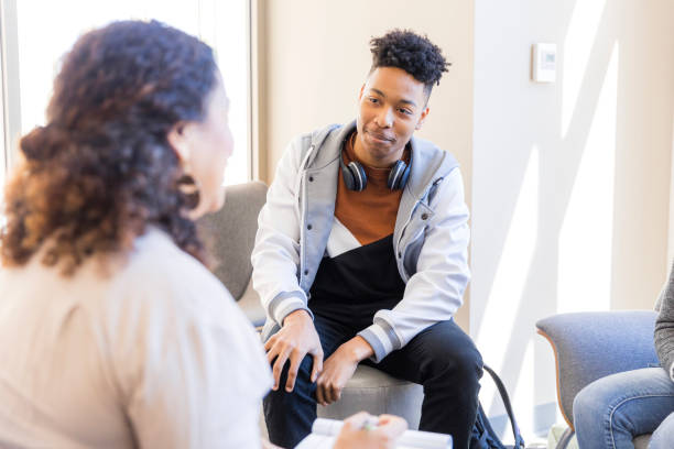 istock Teenager in Group Therapy Session with Counselor 2199176568