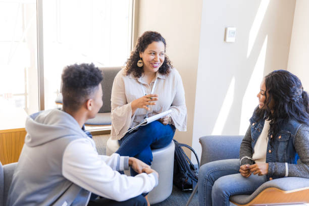 istock Group Therapy Session: Diverse Young Adults Discussing Mental Health 2199176570