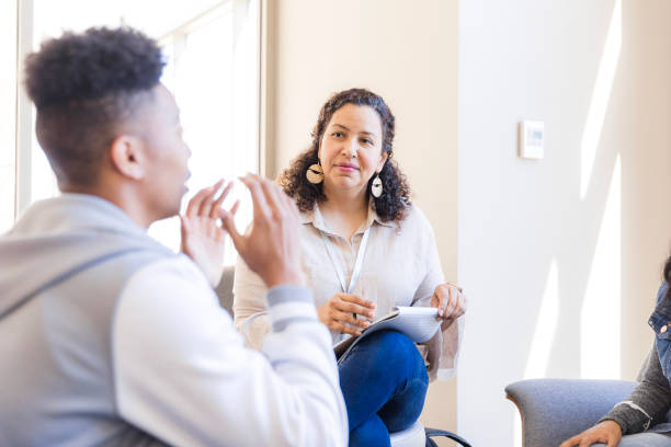 istock Group Therapy Session: Mental Health Professional Counseling Patients 2199176589