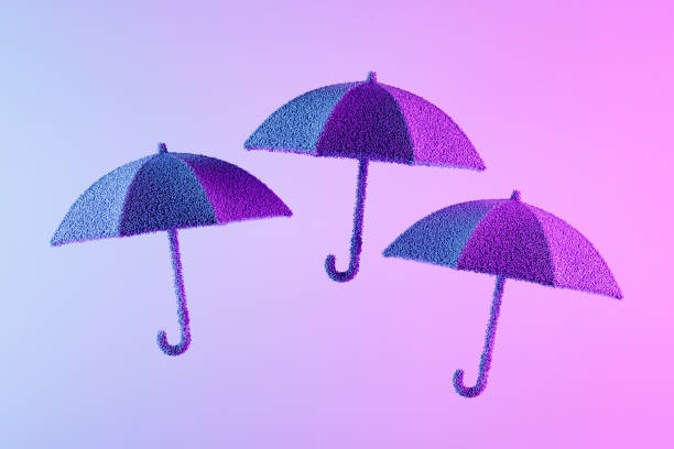 Umbrella toy on light green background with a copy space