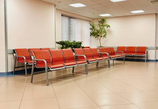 istock A modern waiting area with red seating and lush greenery, creating an inviting atmosphere 2199181156