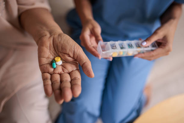 istock Elderly Woman Holding Medication 2199184062