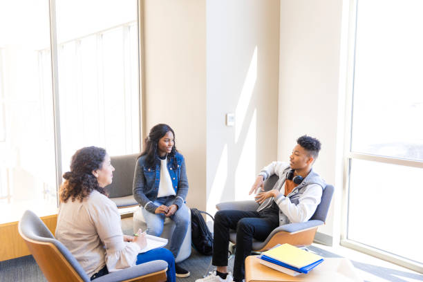 istock Group Therapy Session: Diverse Students Discussing Mental Health 2199184328