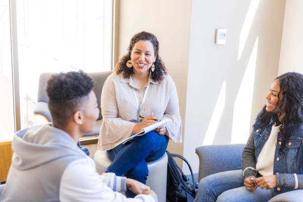 istock Group Therapy Session: Diverse Young Adults Discussing Mental Health 2199184337