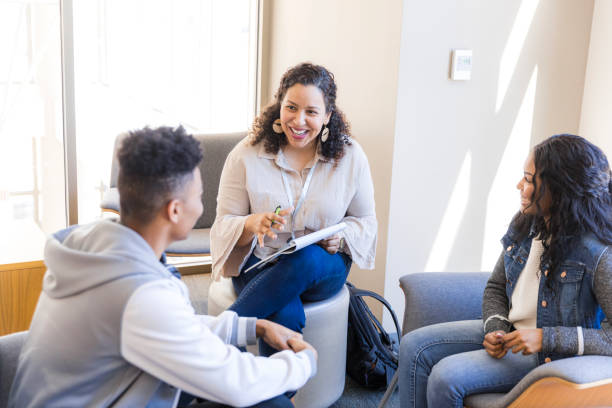 istock Group Therapy Session:  Diverse Young Adults Discussing Mental Health 2199184347