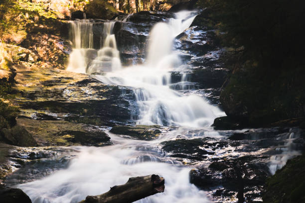 Majestic Waterfall Cascading Over Rocky Cliffs in Scenic Bavarian Nature