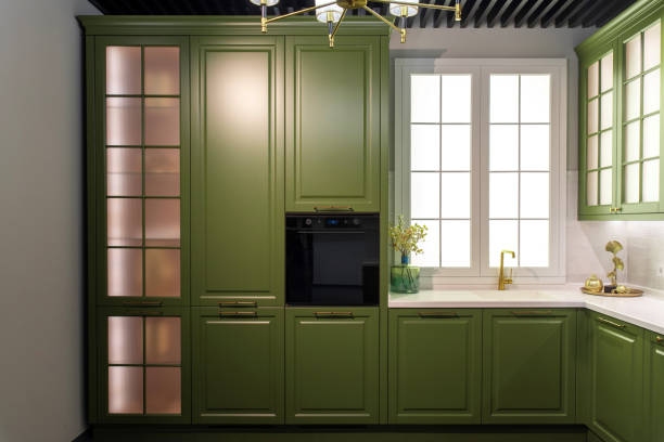 istock Stylish kitchen with a built-in oven and green cabinets 2199186884
