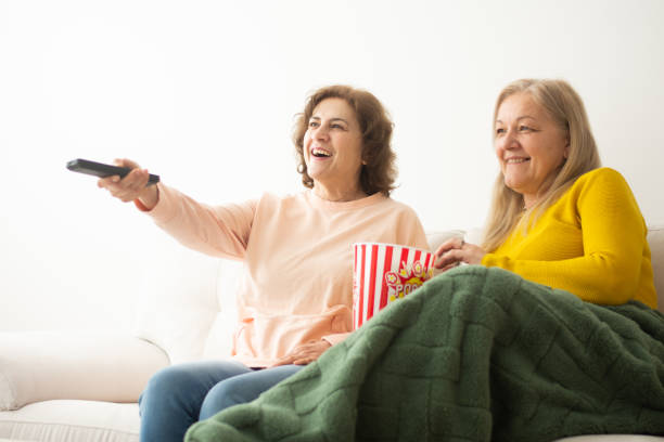 istock Female friends watching TV 2199193508