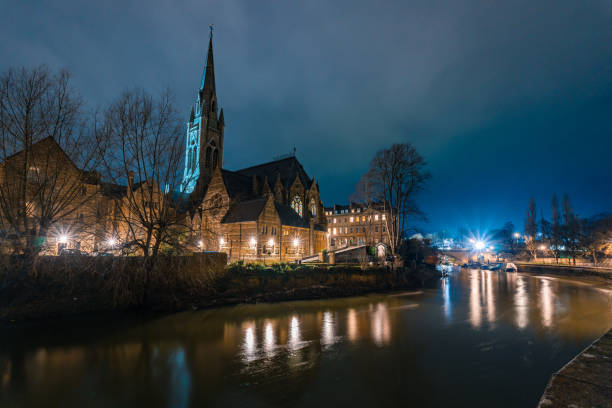 Dusk-time view over the River Severn in the city of Worcester, UK, looking towards the magnificent Worcester Cathedral.