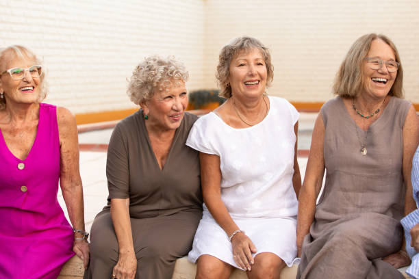 istock Fun senior women friends having fun together 2199211088