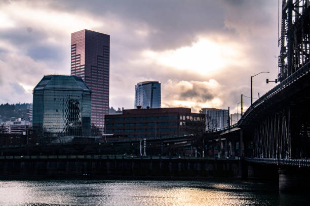 Color Photograph of the Willamette River in Portland, Oregon with a partly cloudy sky.