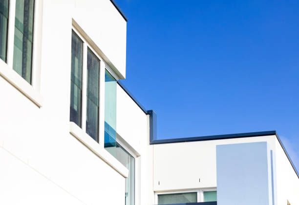 Closeup top part of modern new house, background with copy space, full frame horizontal composition