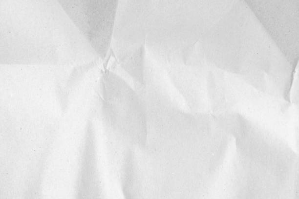 istock White recycled craft paper texture as background. Grey paper texture, Old vintage page or grunge vignette of old newspaper. Pattern rough art creased grunge letter. Hardboard with copy space for text. 2199245585