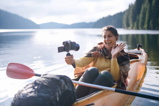 istock Kayaking through breathtaking landscapes while sharing the journey online. 2199247665