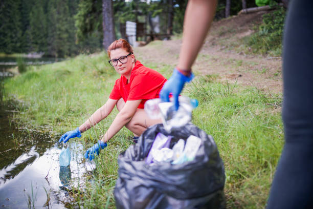Community members join forces to clear garbage from a park, showing their commitment to environmental sustainability.